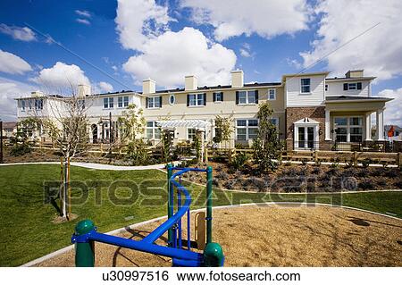 Exterior of Townhomes with Childrens Park View Large Photo Image Stock Photograph - Exterior of Townhomes with Childrens Park. Fotosearch