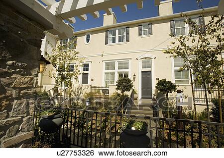 Stock Photograph - Exterior of Traditional Townhouses. Fotosearch
