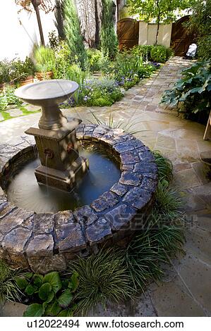 Picture - Rock Fountain in Spanish Style Courtyard. Fotosearch