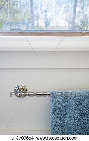 Picture - Blue Towel on Towel Rack. Fotosearch