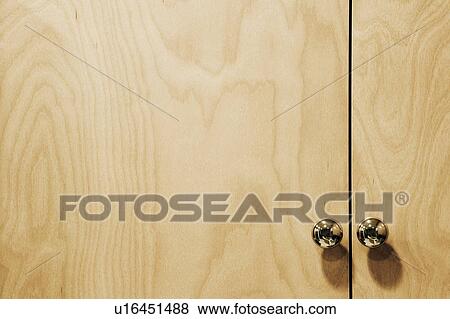 Chrome Knobs on Wood Cupboard View Large Photo Image Stock Photo - Chrome Knobs on Wood Cupboard. Fotosearch