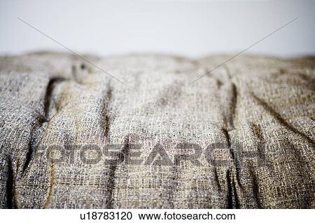 Stock Image - Contemporary Textured Neutral Couch Cushion. Fotosearch