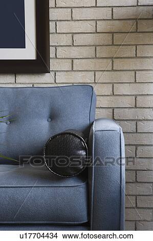 Detail of a blue sofa with black pillow View Large Photo Image Picture - Detail of a blue sofa with black pillow. Fotosearch