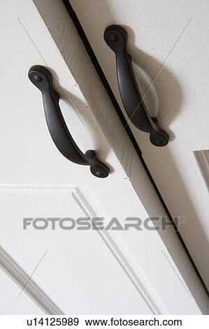 Detail of iron cabinet door handles, close up View Large Photo Image Stock Photo - Detail of iron cabinet door handles, close up. Fotosearch