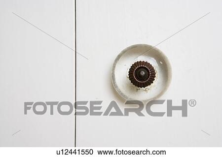 Stock Image - Detail of Knob on White Cabinet. Fotosearch