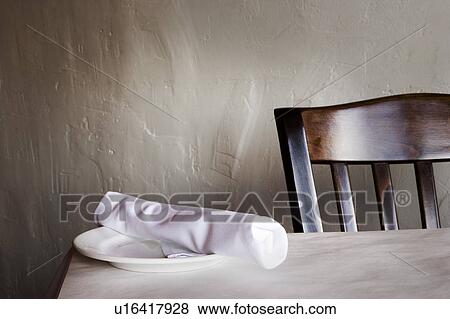 Stock Photo - Restaurant Table with Napkin Rolled Silverware. Fotosearch