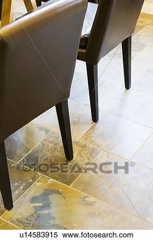 Stock Photography - Tile Floor and Contemporary Leather Chairs. Fotosearch