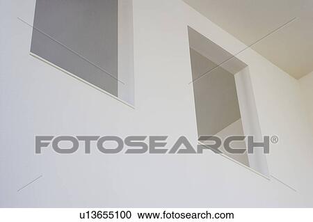 Two Cut Outs in White Wall View Large Photo Image Stock Image - Two Cut Outs in White Wall. Fotosearch