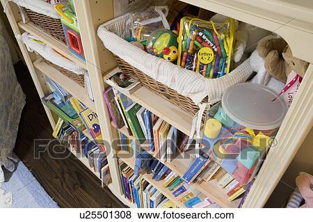 Detail of book shelf with kids toys and books View Large Photo Image Stock Photo - Detail of book shelf with kids toys and books. Fotosearch