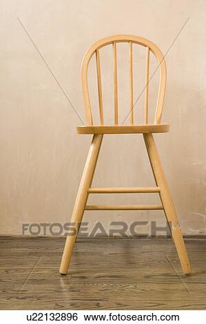 Detail of high chair on a hardwood floor View Large Photo Image Stock Photograph - Detail of high chair on a hardwood floor. Fotosearch