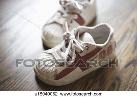 Detail of kids sneakers on hardwood floor View Large Photo Image Stock Image - Detail of kids sneakers on hardwood floor. Fotosearch