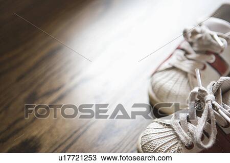 Detail of kids sneakers on hardwood floor View Large Photo Image Stock Image - Detail of kids sneakers on hardwood floor. Fotosearch