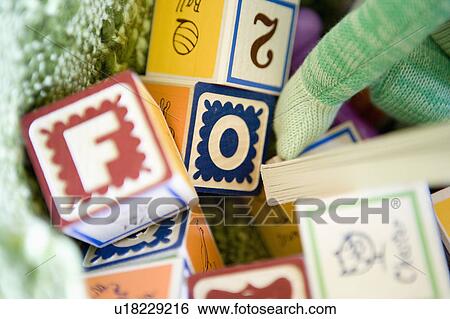 Stack of building blocks, close up View Large Photo Image Stock Photograph - Stack of building blocks, close up. Fotosearch