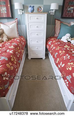 Stock Photo - Two childrens bed wi dresser, high angle. Fotosearch