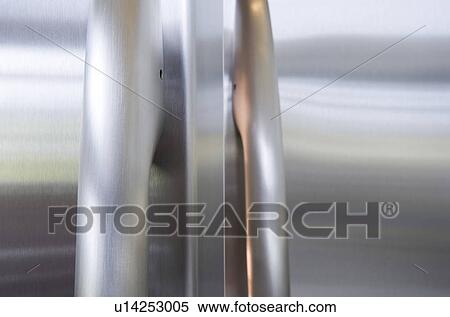 Stock Photography - Close-up of stainless steel refrigerator door handle. Fotosearch