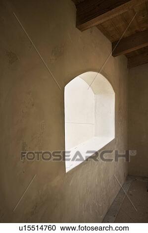 Stock Image - Detail of arched window. Fotosearch
