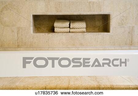 Stock Photograph - Detail of bathtub and towels. Fotosearch