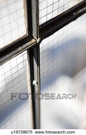Stock Photography - Detail of industrial window and frame. Fotosearch