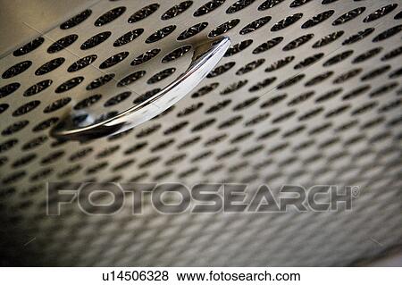 Stock Photo - Detail of stainless steel filter with handle. Fotosearch