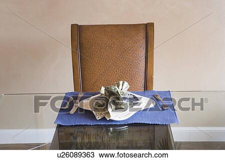 Detail of a place setting on a glass table View Large Photo Image Stock Image - Detail of a place setting on a glass table. Fotosearch