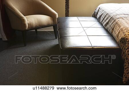 Stock Photo - Leather bench in bedroom. Fotosearch