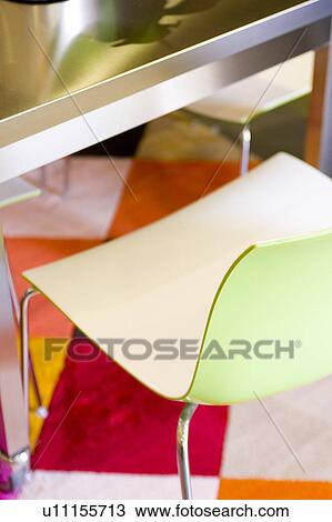 Modern Green Plastic Chair on Bright Rug View Large Photo Image Stock Image - Modern Green Plastic Chair on Bright Rug. Fotosearch