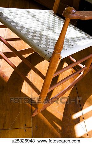 Rocking chair with woven seat View Large Photo Image Stock Photo - Rocking chair with woven seat. Fotosearch