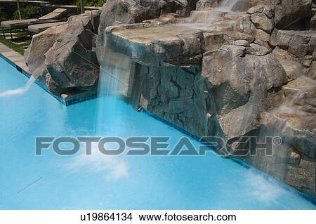 Rock Waterfall to Swimming Pool View Large Photo Image Picture - Rock Waterfall to Swimming Pool. Fotosearch