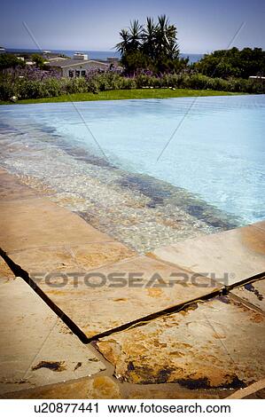 Swimming pool and stone deck View Large Photo Image Stock Image - Swimming pool and stone deck. Fotosearch