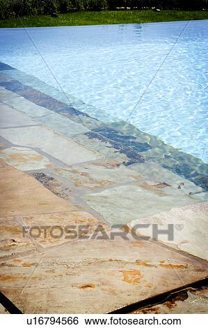 Swimming pool and stone deck View Large Photo Image Stock Photograph - Swimming pool and stone deck. Fotosearch