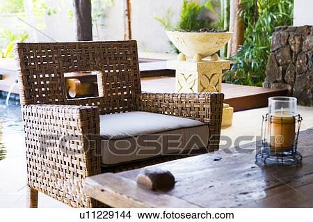 Whicker armchair and table View Large Photo Image Picture - Whicker armchair and table. Fotosearch