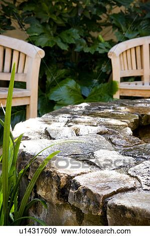 Stock Photo - Wood bench in garden. Fotosearch
