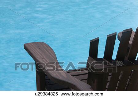Wood Deck Chair by Swimming Pool View Large Photo Image Stock Photography - Wood Deck Chair by Swimming Pool. Fotosearch