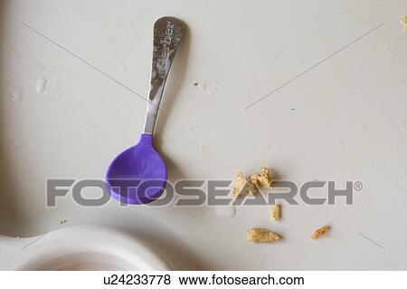 Detail of dirty high chair tray with baby spoon View Large Photo Image Stock Photo - Detail of dirty high chair tray with baby spoon. Fotosearch