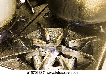 Pot boiling on dirty gas burner View Large Photo Image Stock Photo - Pot boiling on dirty gas burner. Fotosearch