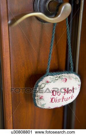 Detail of door handle with do not disturb sign. View Large Photo Image Stock Image - Detail of door handle with do not disturb sign.. Fotosearch