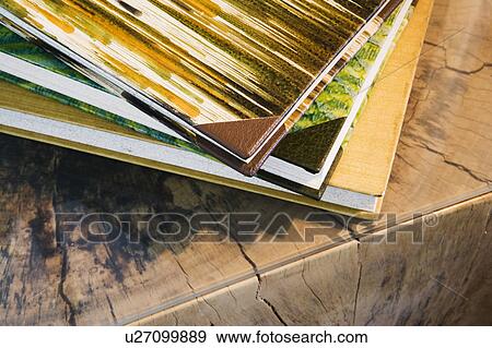 Stock Photo - Hard Back Books on Log Table. Fotosearch