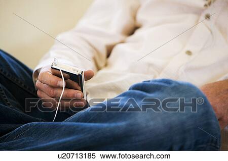Man Listening to MP3 Player View Large Photo Image Stock Photography - Man Listening to MP3 Player. Fotosearch