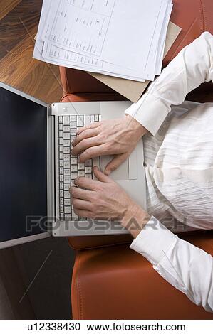 Man Working on Laptop in Modern Living Room View Large Photo Image Stock Image - Man Working on Laptop in Modern Living Room. Fotosearch