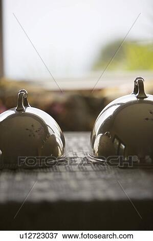 Stock Photo - Metal platter covers for food. Fotosearch