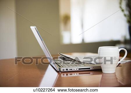 Picture - Newspaper and Laptop. Fotosearch
