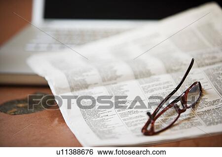 Stock Photograph - Newspaper and Laptop. Fotosearch