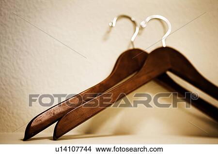 Picture - Two Wood Hangers with Brass Hooks. Fotosearch
