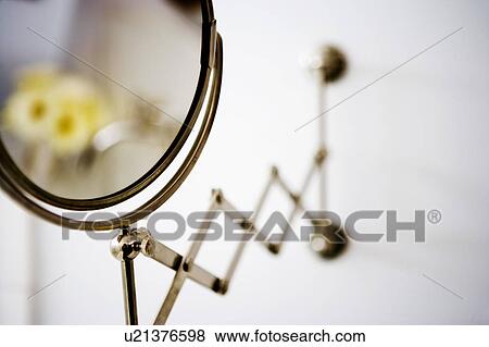 Stock Photo - Wall mounted cosmetic mirror. Fotosearch
