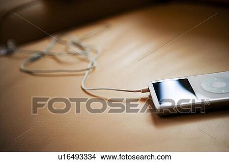 White MP3 Player on Leather Armchair View Large Photo Image Picture - White MP3 Player on Leather Armchair. Fotosearch