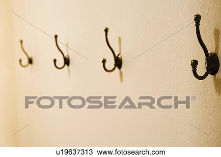 Stock Image - Black Hooks on Wall. Fotosearch