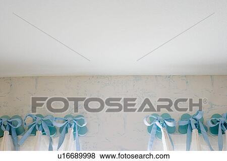 Stock Photo - Blue curtains in bedroom. Fotosearch