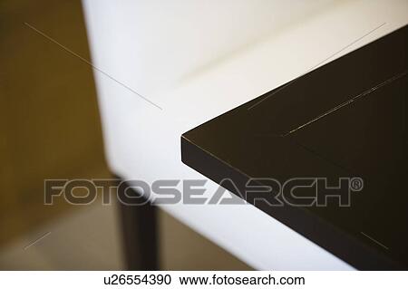 Dark Wood Table and Contemporary White Chair View Large Photo Image Stock Image - Dark Wood Table and Contemporary White Chair. Fotosearch