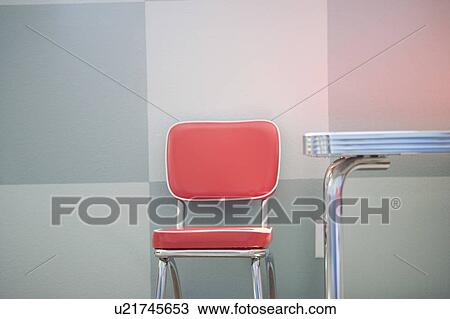 Detail of a red and chrome Retro Style childrens table with chair View Large Photo Image Stock Image - Detail of a red and chrome Retro Style childrens table with chair. Fotosearch