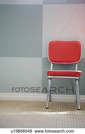 Detail of red childrens chair against a checkered wall View Large Photo Image Stock Photo - Detail of red childrens chair against a checkered wall. Fotosearch